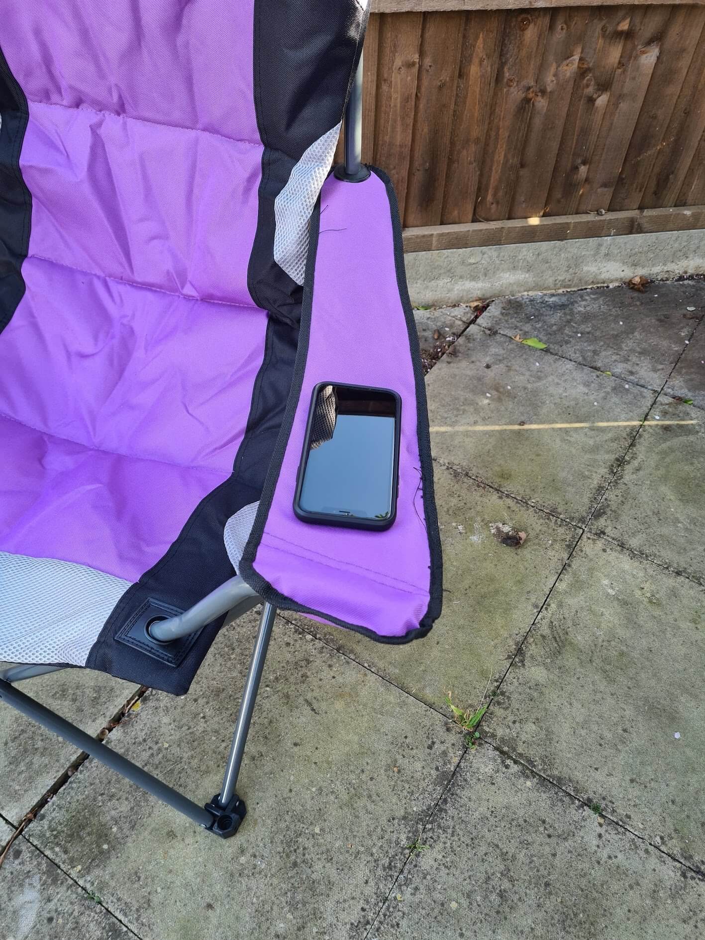 Trail Camping Chair - The Kestrel Deluxe High Back Review - phone on arm rest